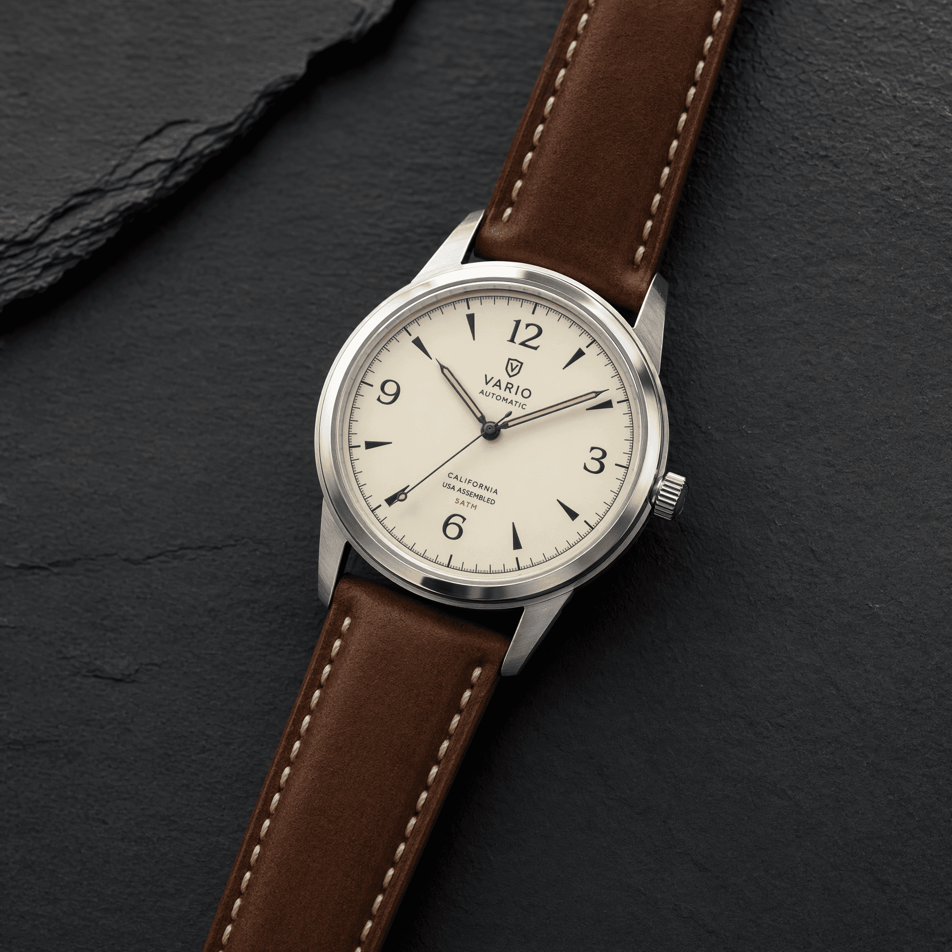 Crisp leather watch on dark slate