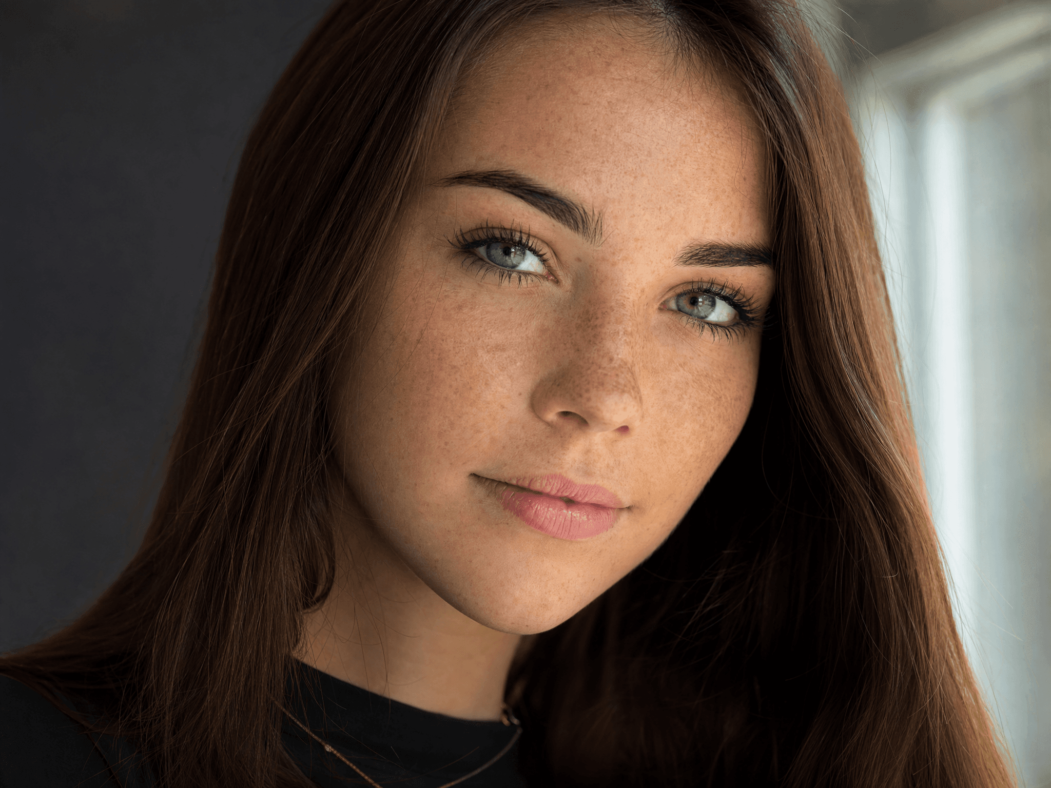Ultra sharp studio portrait with freckles